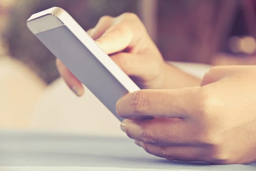 Teenage girl text messaging on her phone