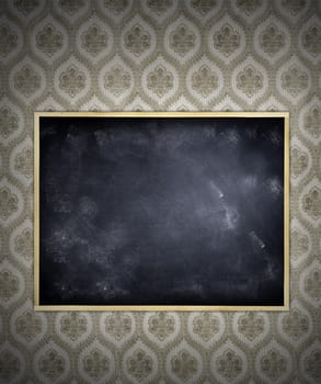 Blank blackboard on wallpaper wall