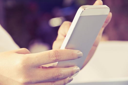 Teenage girl text messaging on her phone