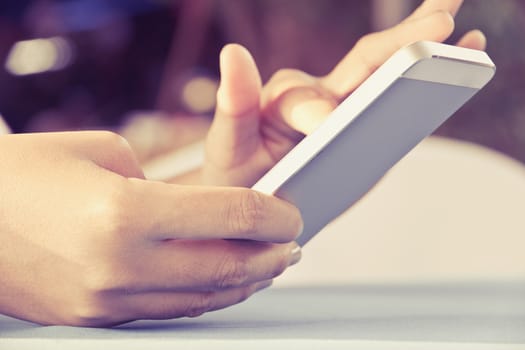Teenage girl text messaging on her phone