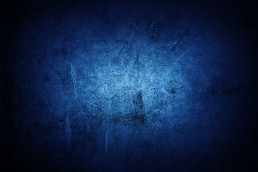 Blue grunge textured wall closeup