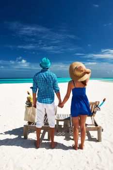 Couple in blue on a tropical beach at Maldives