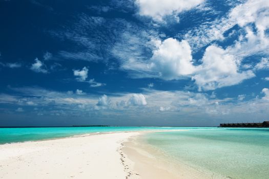 Beautiful island beach with sandspit at Maldives