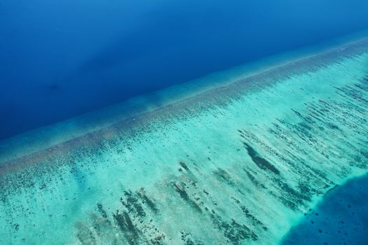 Group of atolls and islands in Maldives from aerial view