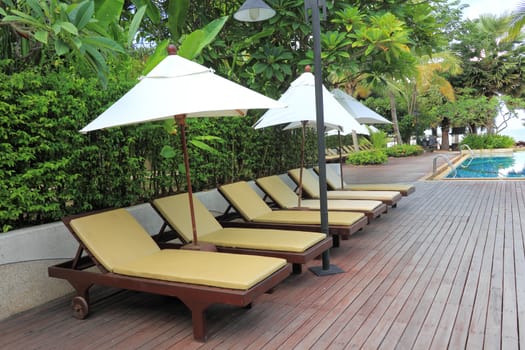 Chaise longue at the poolside in Thailand