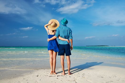 Couple in blue on a tropical beach at Maldives