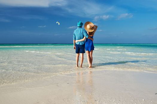 Couple in green on a tropical beach at Maldives