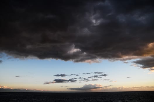 Cloudscape, Colored Clouds at Sunset near the Ocean