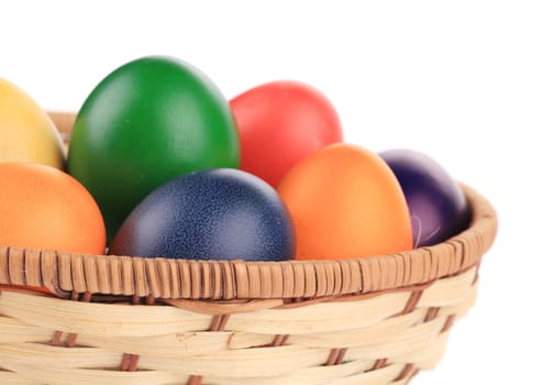 Easter eggs in a basket. On a white background.