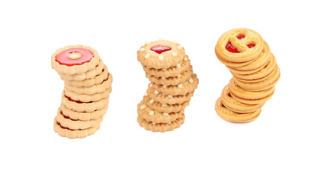 Three stacks of different biscuits. Isolated on a white background.