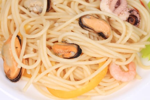 Sea salad with spaghetti. Located on the whole background.