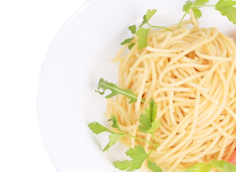 close up of spaghetti with basil. isolated on a white background