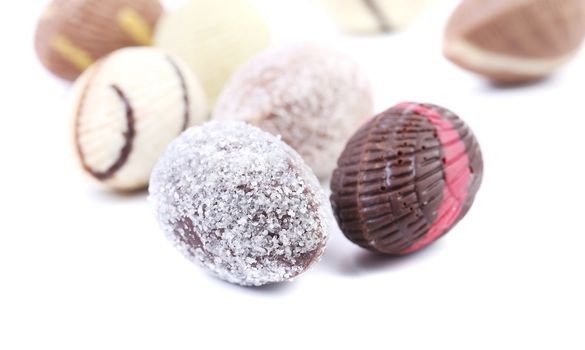 Chocolate seashells and stones. Isolated on a white background