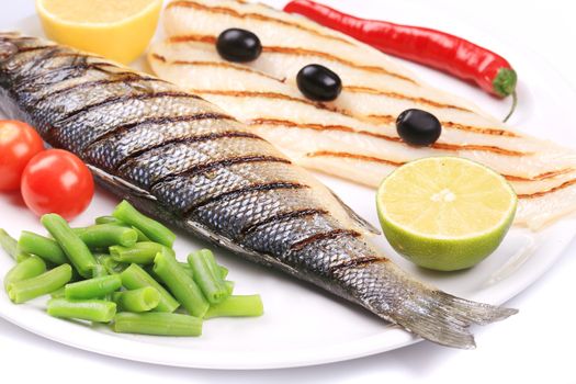 Grilled seabass with pangasius fillet. Whole background.