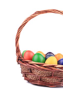 Easter eggs in a basket. On a white background.