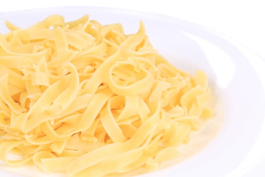 Tagliolini on plate close up. Macro. Whole background.