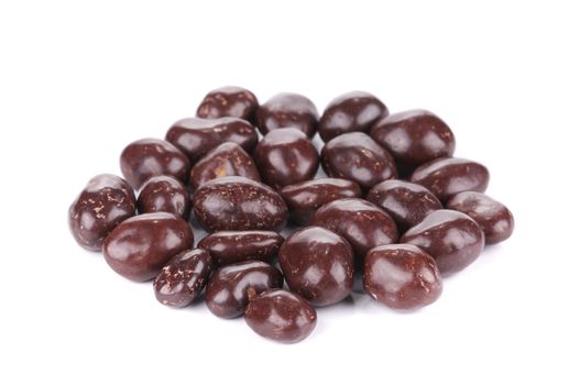 Dark brown dragee in chocolate cover. Isolated on a white background.