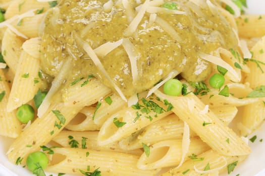 Pasta with pesto sauce. Close up. Whole background.