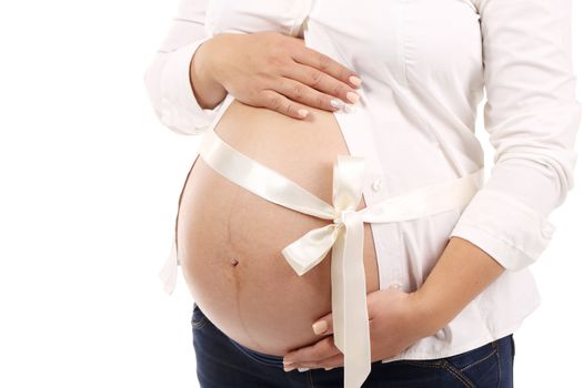 Belly of pregnant woman. Isolated on a white background