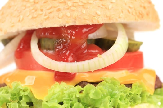 Cheeseburger with onion and cucumber. Isolated on a white background.