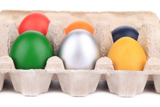 Easter eggs in a box. On a white background.