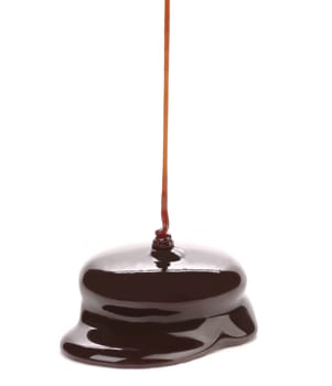 Flowing dark caramel. On a white background.