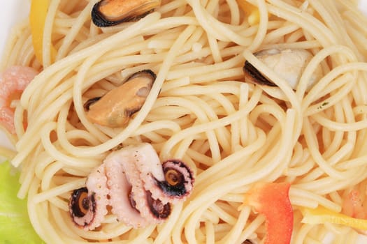 Sea salad with spaghetti. Located on the whole background.
