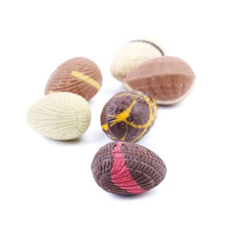 Chocolate seashells and stones. Isolated on a white background