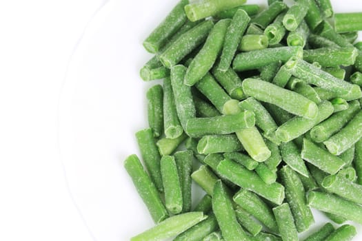 Close up of frozen green beans. Whole background.