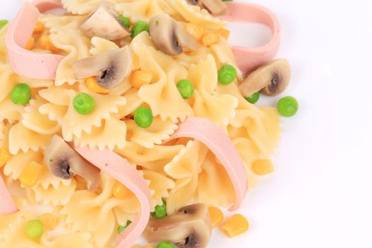 Pasta with mushrooms and sausage. Isolated on a white background.