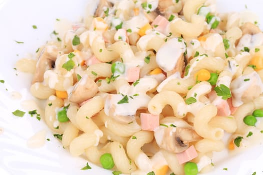 close up of pasta cavatappi with vegetables and sausage on a white plate. isolated on a white background