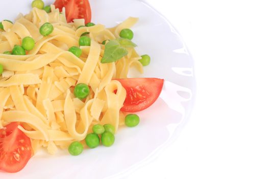Pasta with green peas on plate close up. Whole background.