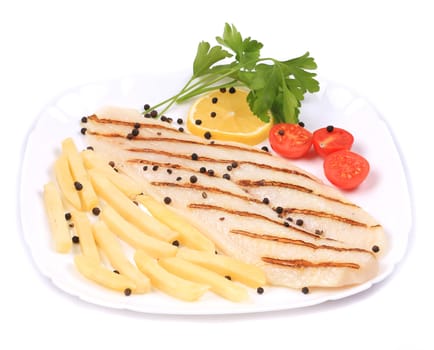 Grilled pangasius steak with vegetables. Isolated on a white background.