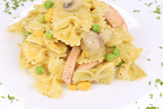 Pasta with mushrooms and sausage. Isolated on a white background.