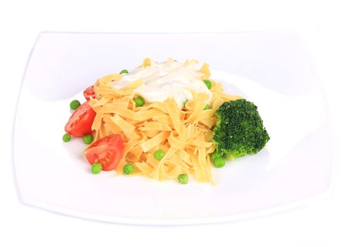 Pasta with dressing and green beans. Isolated on a white background.