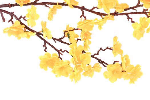 Artificial yellow flowers. Isolated on a white background.