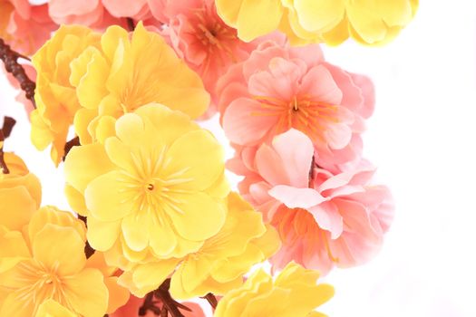 Artificial flowers closeup. Isolated on a white background.
