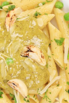 Pasta with pesto sauce. Close up. Whole background.