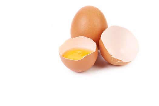 Close up of broken egg. Isolated on a white background.