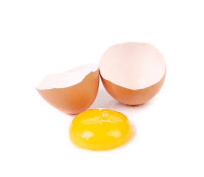 Close up of broken egg. Isolated on a white background.