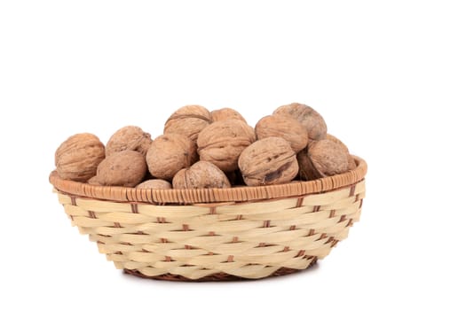 walnuts on basket. Isolated on a white background.