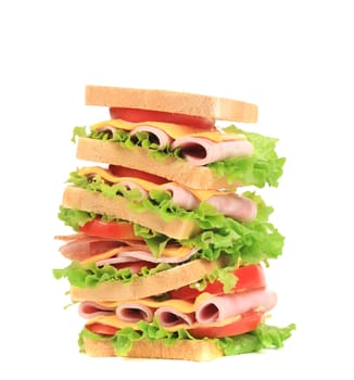 Big sandwich with ham and cheese. Isolated on a white background.