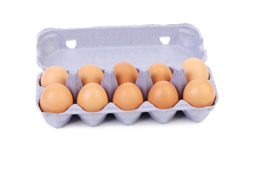 Ten eggs in a blue carton box. isolated on a white background