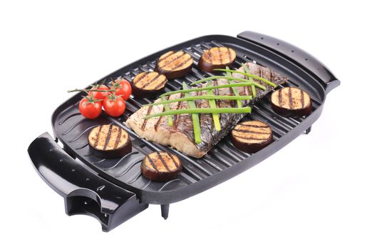 Grilled fish and vegetables. Isolated on a white background.