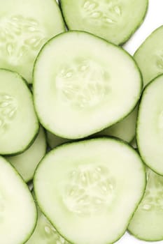 Close up fresh green sliced cucumber. Whole background.