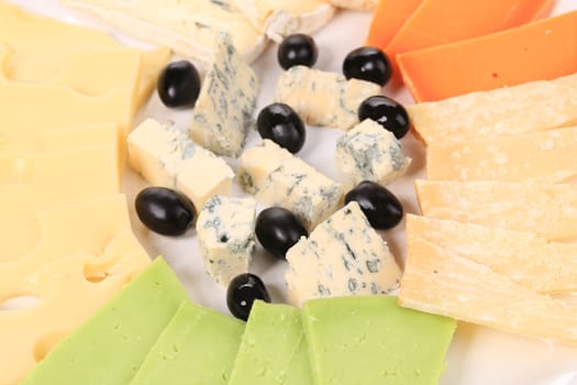 Various tasty cheese slices. Isolated on a white background.