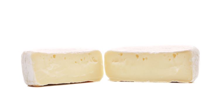Close up of brie cheese. Isolated on a white background.