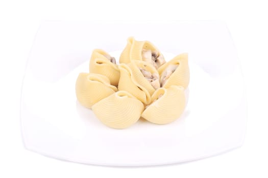 pasta shells on stuffed with mushrooms on a white plate.