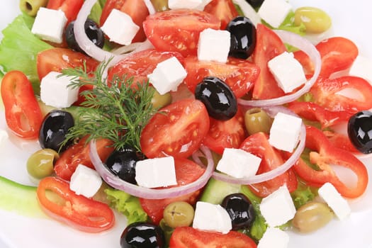 Close up of greek salad. Isolated on a white background.