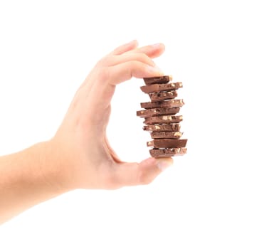 Hand holds milk chocolate with nuts.  isolated on a white background